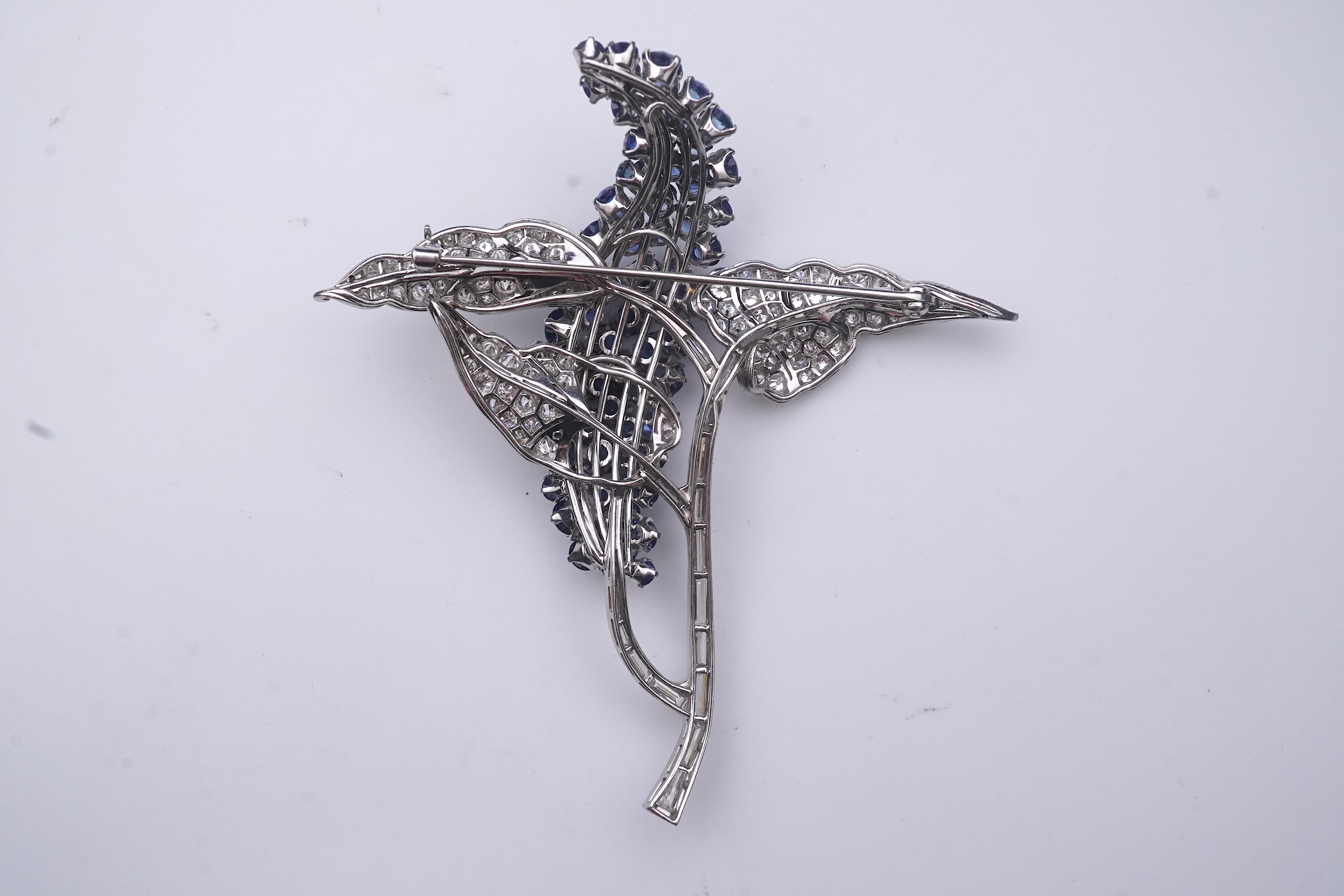 A sapphire and diamond brooch, mid 20th century